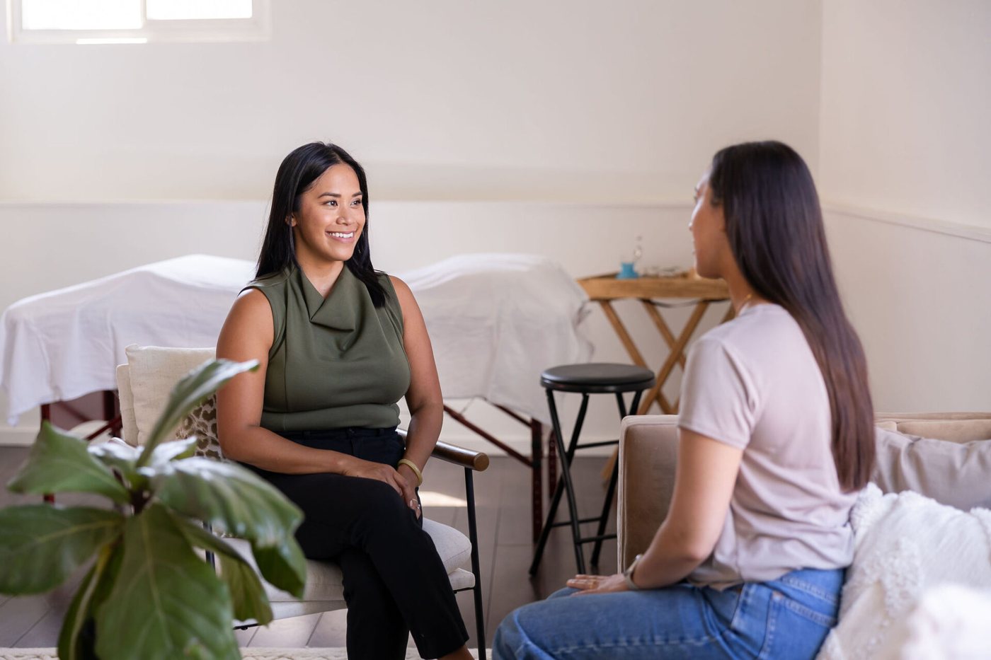 Dr. Monee Dulay talking with a client during a consultation in the studio