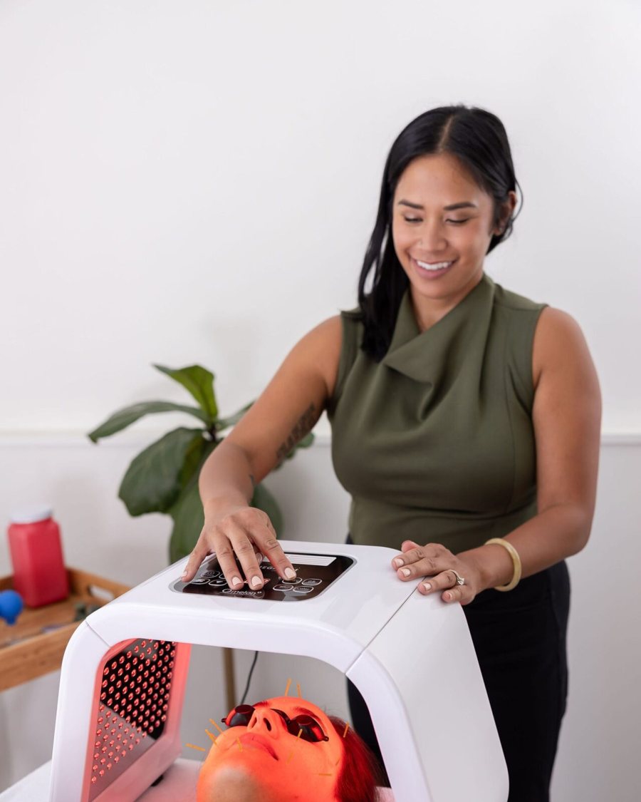 Dr. Monee setting up an LED light therapy session